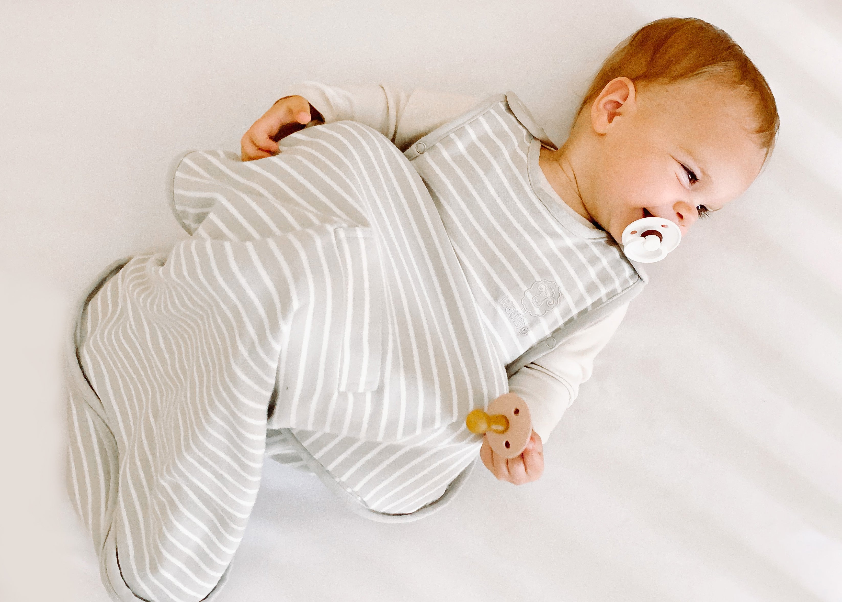 What to Wear Under a Sleep Sack: A Practical Guide for New Parents – Woolino