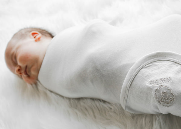 Here's Why Your Newborn Is Grunting & Squirming While Sleeping